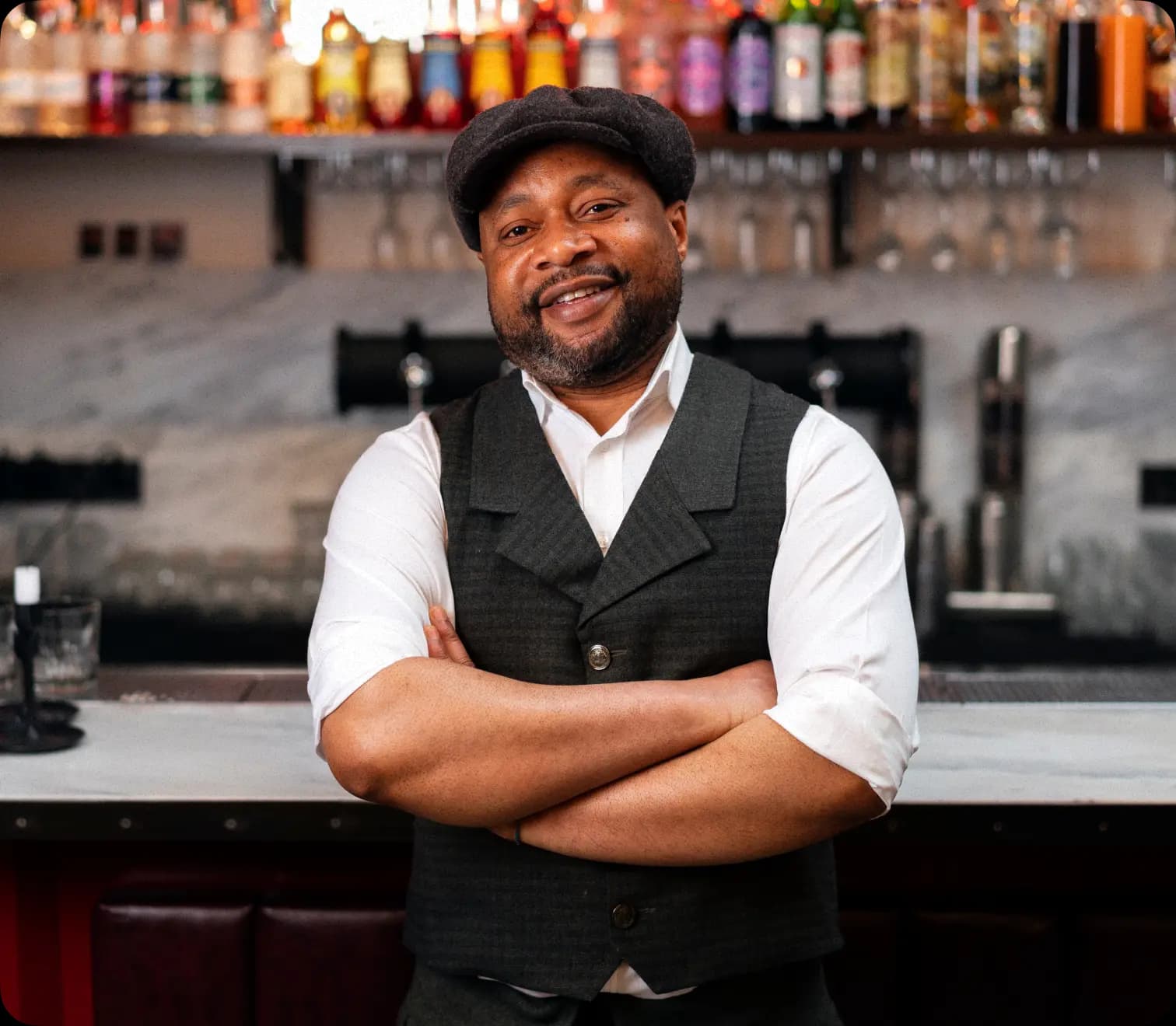 Business owner standing confidently in their restaurant or shop, representing entrepreneurial success with Linqart